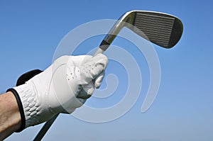 Golfer Holding an Iron (Golf Club)