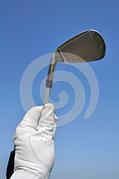 Golfer Holding an Iron (Golf Club)