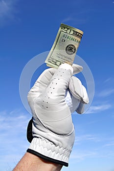 Golfer Holding a Twenty Dollar Bill photo