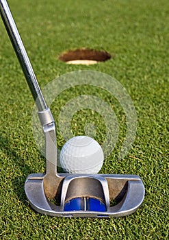 Golfer lining up a short putt