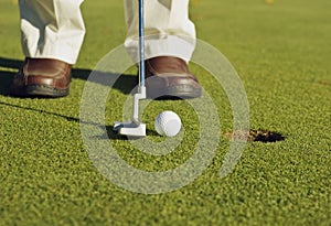 Golfer making putt