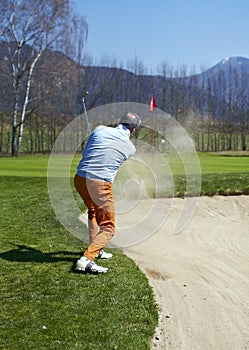 Golfer man at the bunker