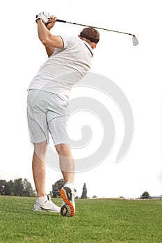 Golfer playing a game of golf