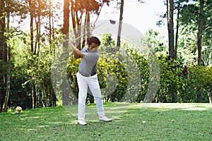 Golfer playing golf in beautiful golf course in the evening golf course with sunshine