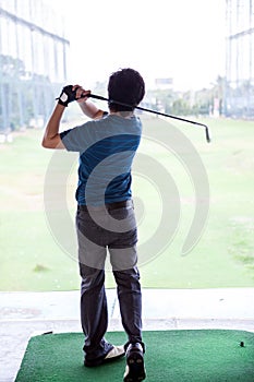 Golfer practicing