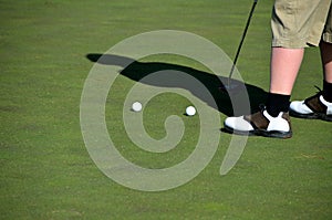 Golfer practising putting