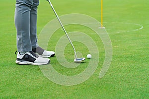 Golfer preparing for a putt Golf ball on the green during golfcourse