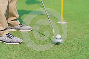 Golfer preparing for a putt Golf ball on the green during golfcourse