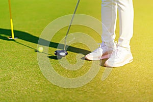 Golfer preparing for a putt Golf ball on the green during golfcourse