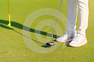 Golfer preparing for a putt Golf ball on the green during golfcourse