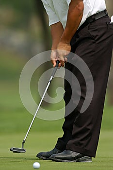 Golfer putting 01 photo
