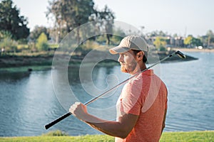 Golfer putting golf ball on the green golf.