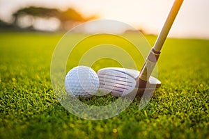 Golfer is putting golf ball on green grass at golf course for training to hole  with blur background a