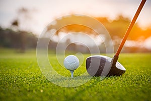 Golfer is putting golf ball on green grass at golf course for training to hole  with blur background a