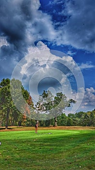 Golfer on putting green photo
