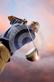 Golfer shooting a golf ball