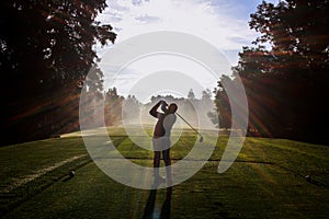 Golfer Silhouette at Dawn