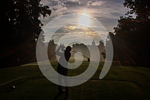 Golfer Silhouette at Dawn