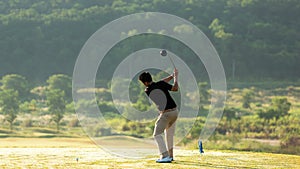 Golfer sport course golf ball fairway. People lifestyle man playing game golf tee off on the green grass.