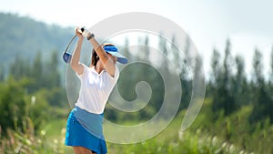 Golfer sport course golf ball fairway. People lifestyle woman playing game golf tee of on the green grass.