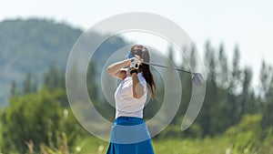 Golfer sport course golf ball fairway. People lifestyle woman playing game golf tee of mountain background. Asia female player gam