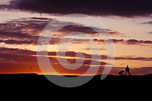 Golfer at sunset