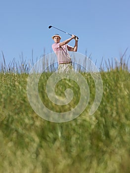 Golfer Swinging A Golf Club