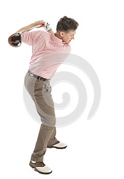 Golfer Swinging Golf Club Against White Background