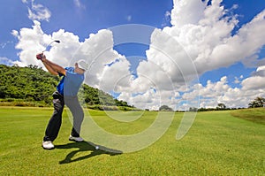 Golfer swinging his gear and hit