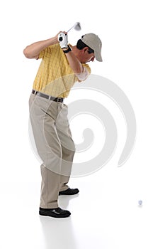 Golfer teeing off