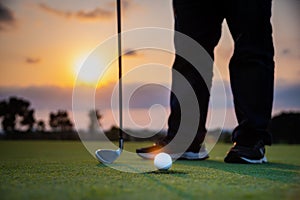 Golfer is teeing off golf ball by golf club from tee golf competition game