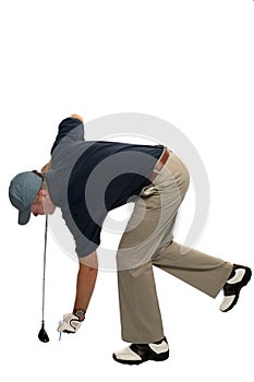 Golfer teeing up