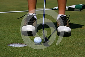 A golfer about to putt