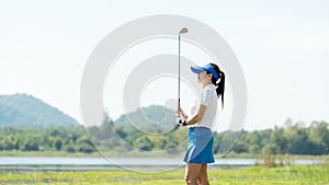 Golfer women sport course golf ball fairway. People lifestyle woman playing game golf tee of on the green grass