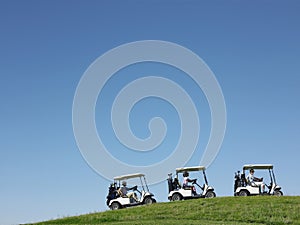 Golfers Driving Carts