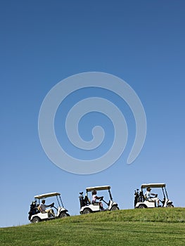 Golfers Driving Carts