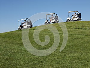 Golfers Driving Carts