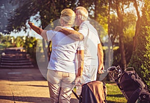 Golfers on golf course in hug