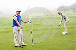 Golfing couple on the golf course