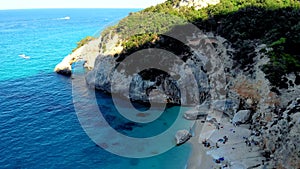 Golfo di Orosei Sardina, View from above, stunning aerial view of beach full of beach umbrellas and people sunbathing