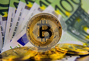 Golg coins bitcoin on euro banknotes photo