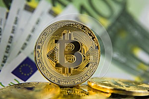 Golg coins bitcoin on euro banknotes photo