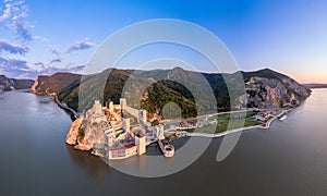 Golubac fortress castle walls standing on Danube river bank in  sunset rays aerial panorama, Serbia