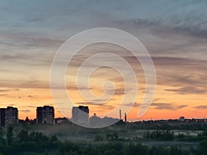 GOMEL, BELARUS City skyline with fog at dusk