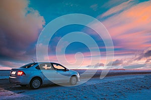 Volkswagen Polo Car Sedan Parking On A Roadside Of Country Road On A Background Of Dramatic Sunset Sky At Winter Season