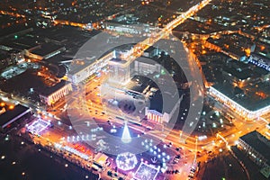 Gomel, Belarus. Main Christmas Tree And Festive Illumination On Lenin Square In Homel. New Year In Belarus. Aerial Night photo