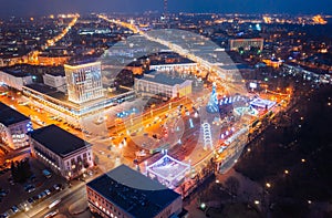 Gomel, Belarus. Main Christmas Tree And Festive Illumination On Lenin Square In Homel. New Year In Belarus. Aerial Night photo