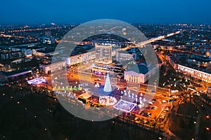 Gomel, Belarus. Main Christmas Tree And Festive Illumination On Lenin Square In Homel. New Year In Belarus. Aerial Night photo