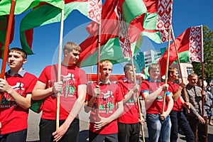 Unidentified Youth From Patriotic Party Brsm Holds Flags On The Celebration Of Victory Day.