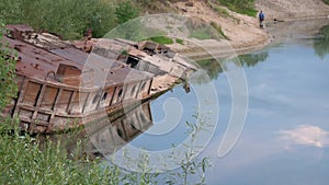 GOMEL, BELARUS old rusty metal river barge on the bay